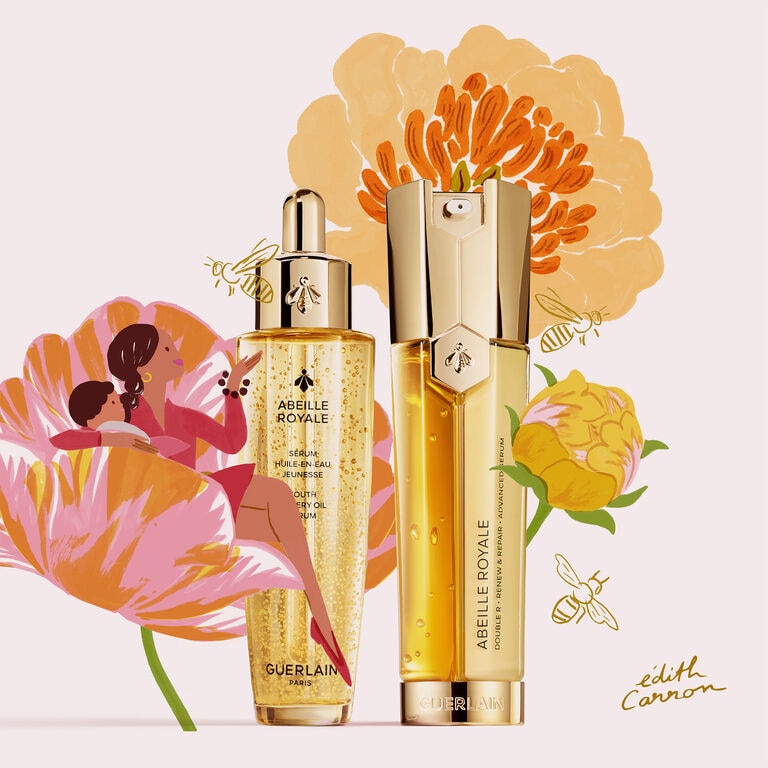 A WOMAN WITH HER CHILD LOOKING AT ABEILLE ROYALE PRODUCTS BY GUERLAIN